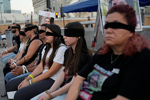 Israel-Hamas war: Israeli hostages' families wear blindfolds in protest for their release